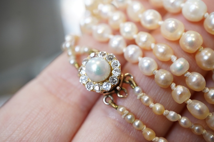 A natural pearl and diamond necklace, early 20th century
